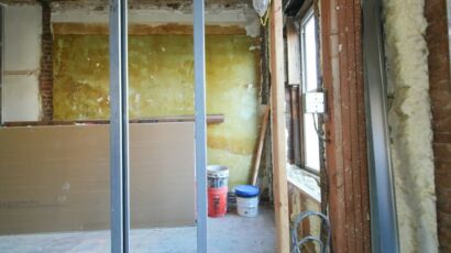Gypsum partition wall framing compared with traditional brick wall construction