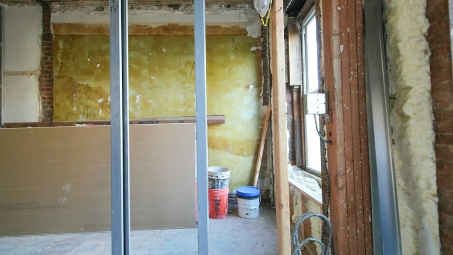 Gypsum partition wall framing compared with traditional brick wall construction