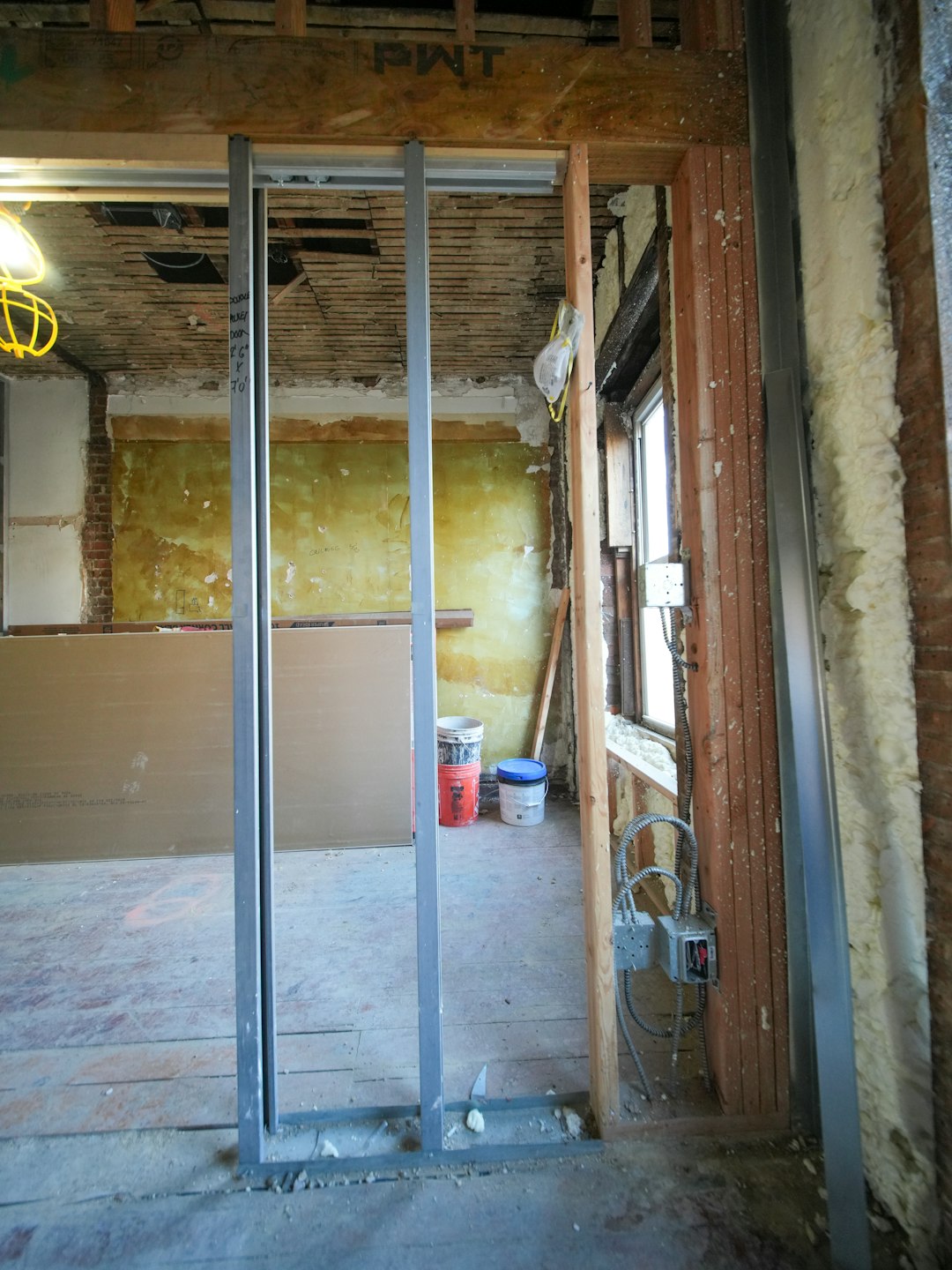 Gypsum partition wall framing compared with traditional brick wall construction