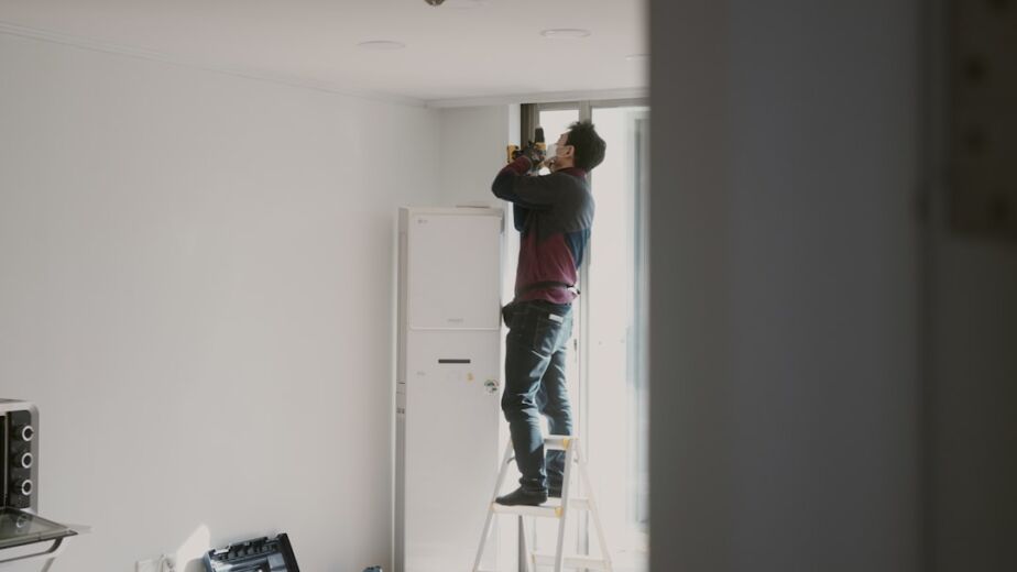 Professional gypsum contractor working on an interior partition in Dubai