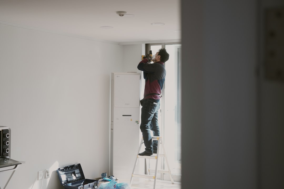 Professional gypsum contractor working on an interior partition in Dubai