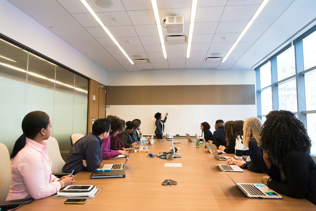 Business professionals discussing employer of record and workforce management services